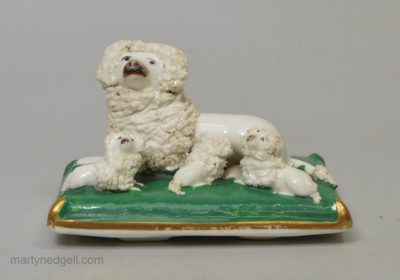 Staffordshire porcelain model of a poodle and pups, circa 1840