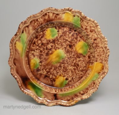 Creamware plate decorated with Whieldon style colours under the glaze, circa 1770
