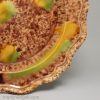 Creamware plate decorated with Whieldon style colours under the glaze, circa 1770
