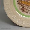 Pearlware pottery child's alphabet plate decorated with a print of a steam train, circa 1880