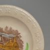 Pearlware pottery child's alphabet plate decorated with a print of a steam train, circa 1880