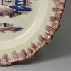 Creamware pottery plate moulded with a shell edge decorated with colours under the glaze, circa 1790