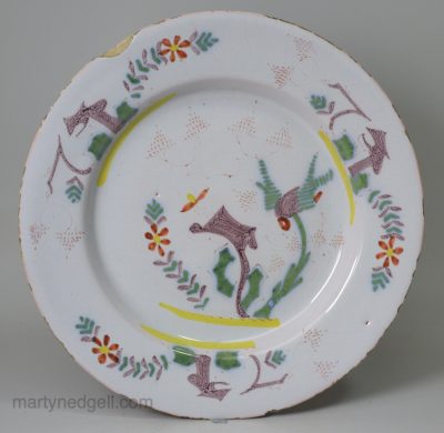 English delft plate decorated with colour under the glaze, circa 1740