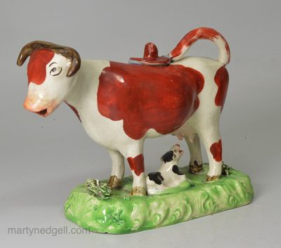 Staffordshire pottery cow creamer decorated with over glaze enamels, circa 1820