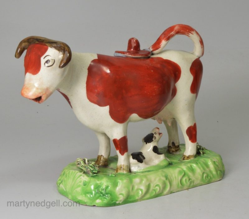 Staffordshire pottery cow creamer decorated with over glaze enamels, circa 1820