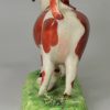 Staffordshire pottery cow creamer decorated with over glaze enamels, circa 1820