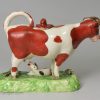 Staffordshire pottery cow creamer decorated with over glaze enamels, circa 1820