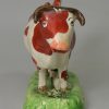 Staffordshire pottery cow creamer decorated with over glaze enamels, circa 1820