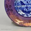 Pearlware pottery cup plate decorated with a blue transfer print and a pink lustre border, circa 1820