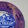 Pearlware pottery cup plate decorated with a blue transfer print and a pink lustre border, circa 1820