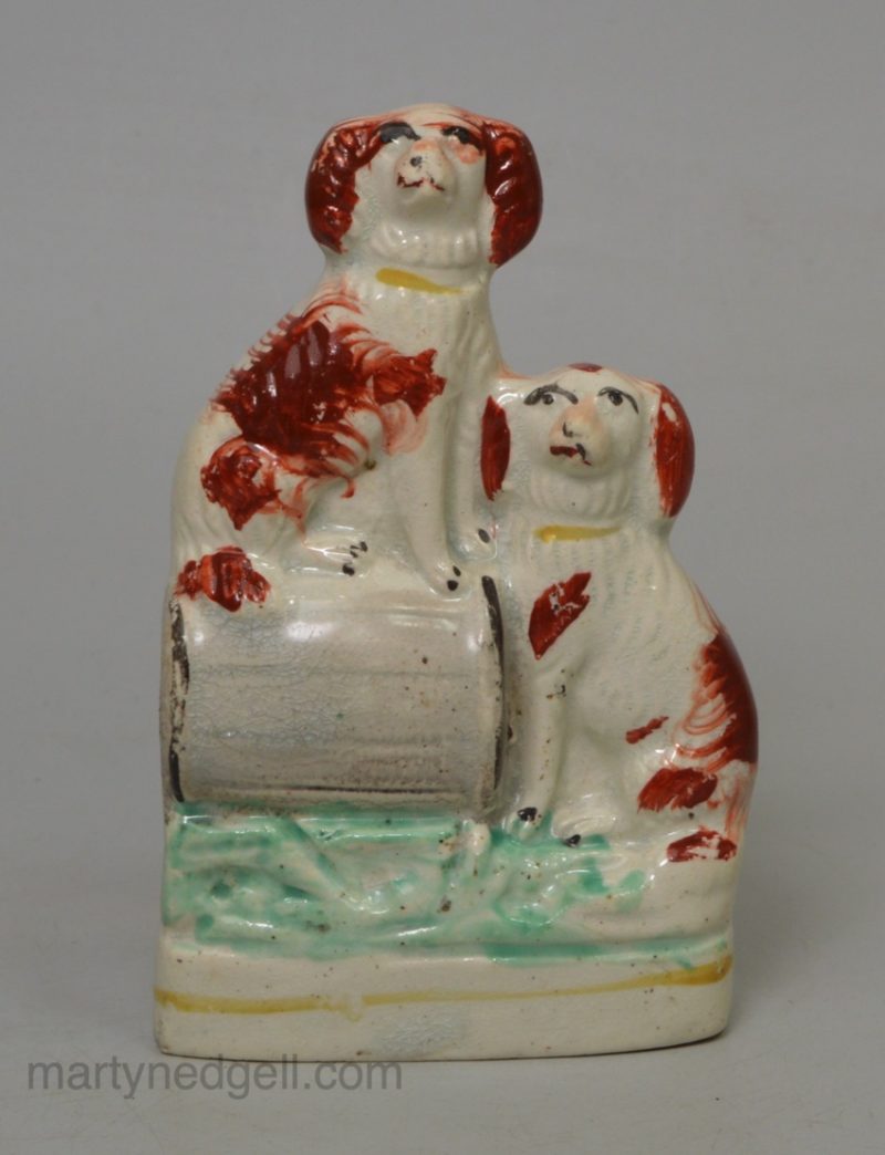 Pair of Staffordshire spaniels on a barrel, circa 1870