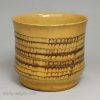 Staffordshire slipware mug with combed decoration, circa 1700
