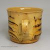 Staffordshire slipware mug with combed decoration, circa 1700