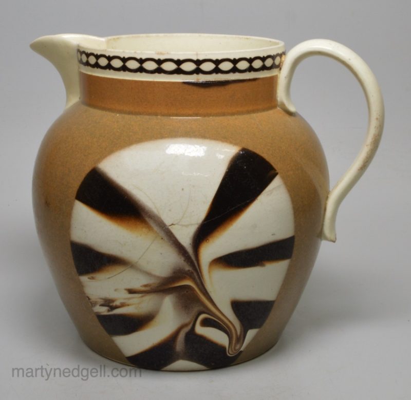 Creamware pottery jug with a mocha fan pattern, circa 1820
