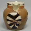 Creamware pottery jug with a mocha fan pattern, circa 1820