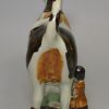 Pearlware pottery cow creamer decorated with colours under the glaze, circa 1820