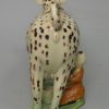 Creamware pottery cow creamer decorated with colours under the glaze, circa 1810