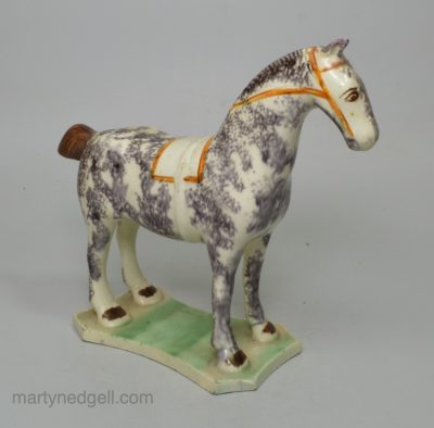 Pearlware pottery horse decorated with colours under the glaze, circa 1820