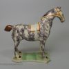Pearlware pottery horse decorated with colours under the glaze, circa 1820