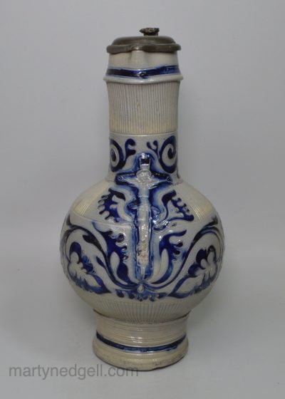 Large Westerwald saltglaze stoneware jug decorated with the crucifixion, circa 1700