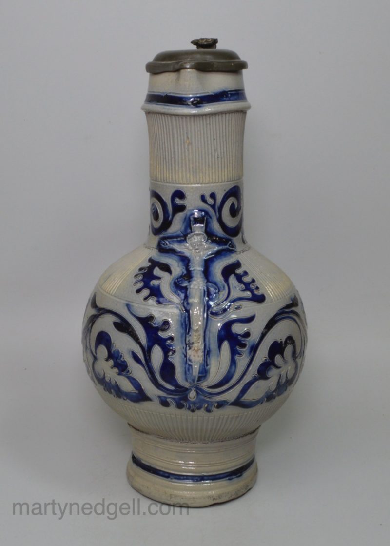 Large Westerwald saltglaze stoneware jug decorated with the crucifixion, circa 1700