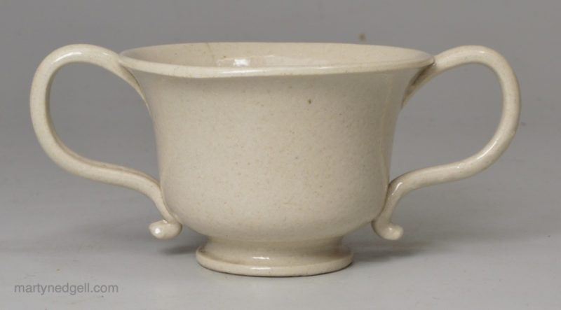 Toy or miniature Staffordshire white saltglaze stoneware loving cup, circa 1760