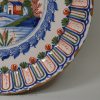 London delft charger decorated in in red, blue and green, circa 1700 probably Vauxhall