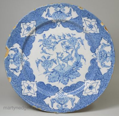 Bristol delft plate decorated in blue with a Qilin and powder blue ground, circa 1740