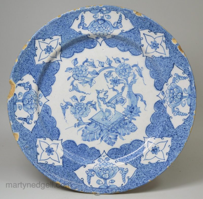 Bristol delft plate decorated in blue with a Qilin and powder blue ground, circa 1740