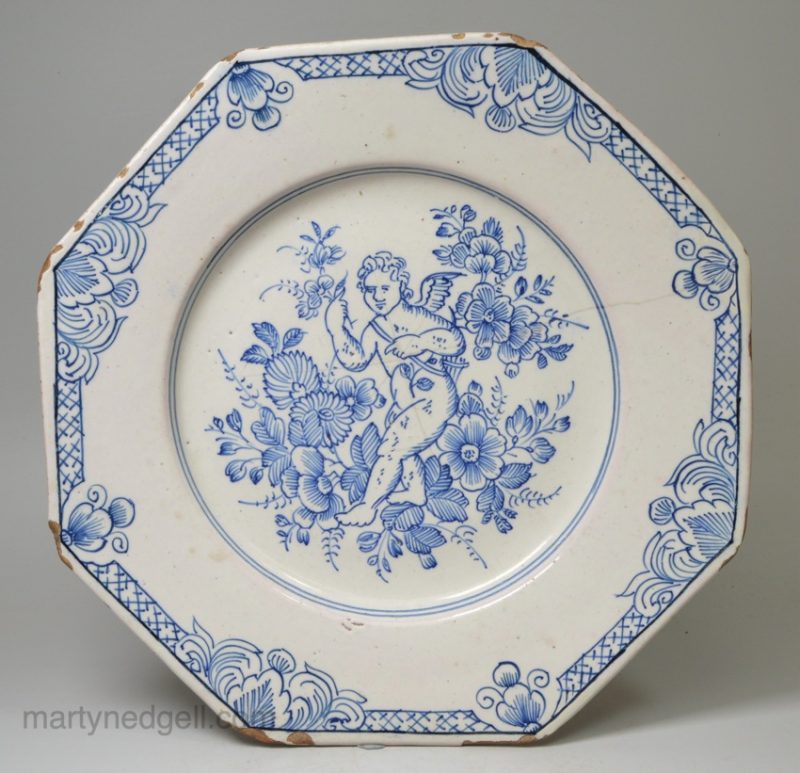 London delft plate decorated with pencil drawn cherub, circa 1720