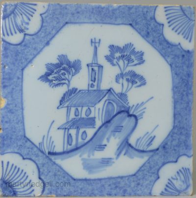 Liverpool delft tile decorated with a church and a powder blue border, circa 1750
