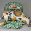 Pearlware pottery cow and calf bocage creamer decorated under the glaze, circa 1800