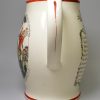 Creamware pottery jug decorated with a print of 'an English JACK-TAR giving MONSIEUR a drubbing', circa 1800