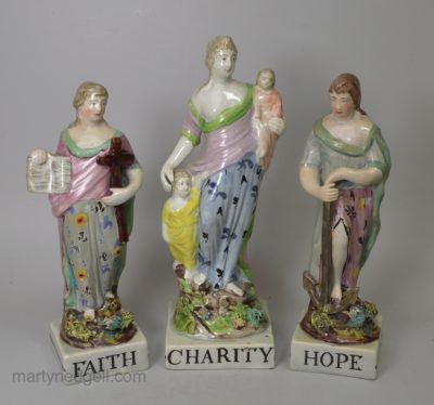 Staffordshire pearlware pottery figural group of 'Faith, Hope and Charity', circa 1820