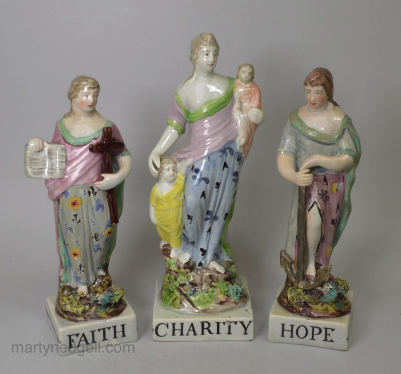 Staffordshire pearlware pottery figural group of 'Faith, Hope and Charity', circa 1820