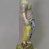Staffordshire pearlware pottery figural group of 'Faith, Hope and Charity', circa 1820