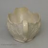 Staffordshire white saltglaze sauceboat moulded with flowers, circa 1760
