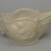Staffordshire white saltglaze sauceboat moulded with flowers, circa 1760