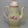 Leeds pottery coffee pot decorated with magenta flowers over the glaze, circa 1780