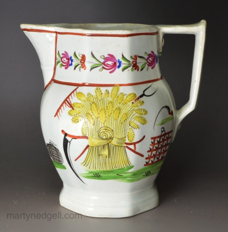 Pearlware pottery jug decorated with Farming implements over the glaze, circa 1820