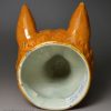 Pearlware pottery stirrup cup decorated with tan oxide under the glaze, circa 1820