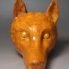 Pearlware pottery stirrup cup decorated with tan oxide under the glaze, circa 1820
