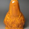 Pearlware pottery stirrup cup decorated with tan oxide under the glaze, circa 1820