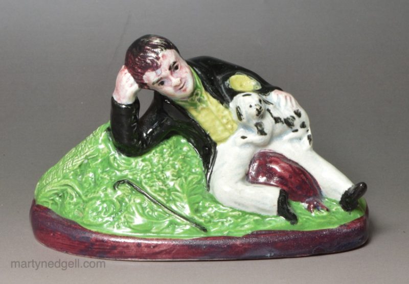 Pearlware pottery figure of a boy and dog, circa 1820, Scottish pottery Portobello