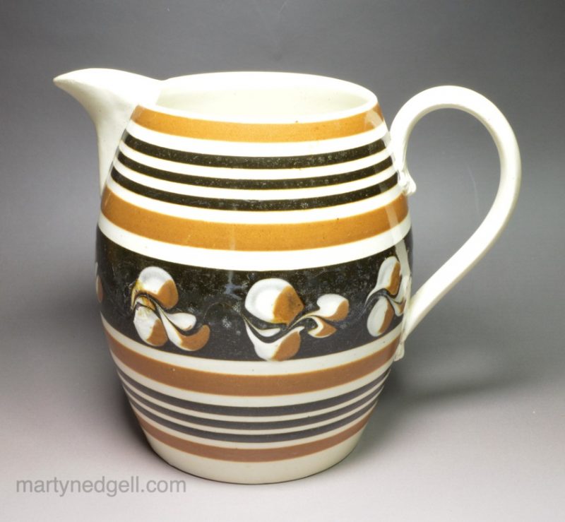Pearlware pottery jug decorated with brown slip, circa 1830