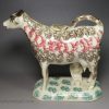 Pearlware pottery cow creamer with sponged decoration, circa 1830