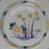 London delft plate decorated in polychrome florals, circa 1750