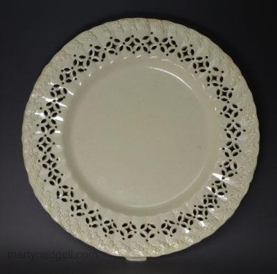 Creamware pottery with a moulded oak leaf border and piercing, circa 1790