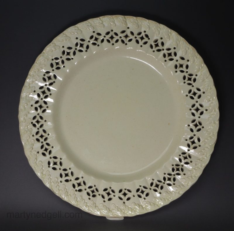 Creamware pottery with a moulded oak leaf border and piercing, circa 1790