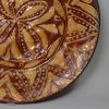 Early Staffordshire slipware dish decorated with a geometric design, circa 1670 - 1700